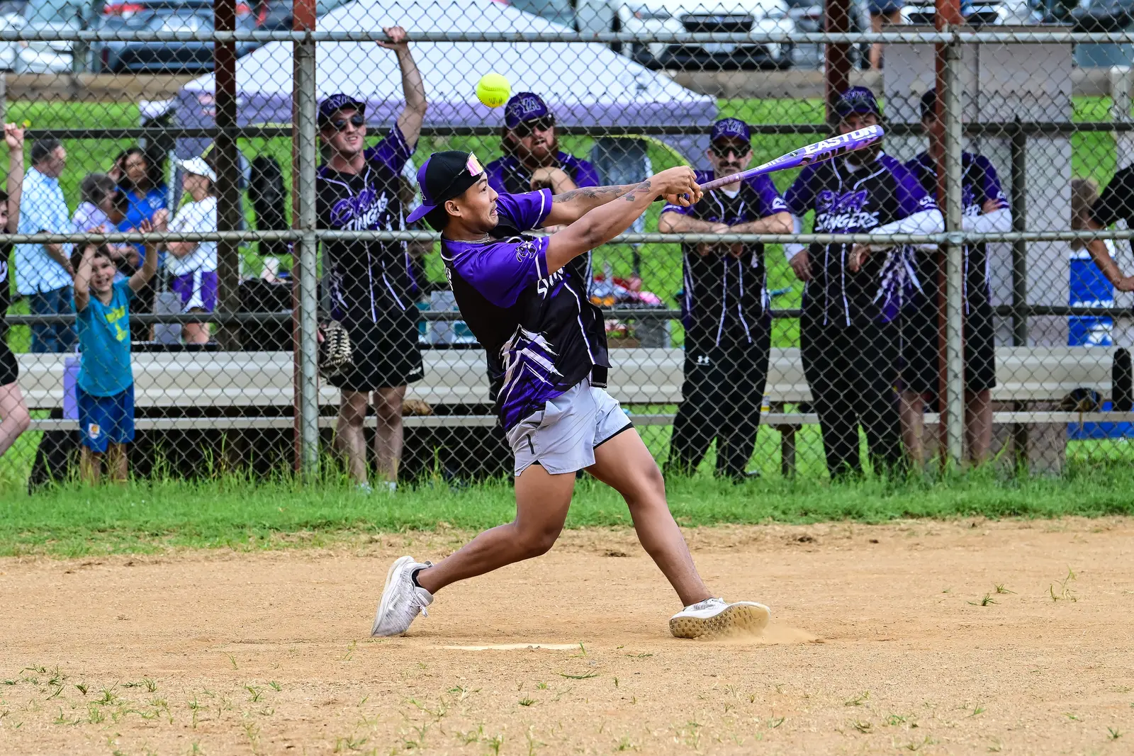 CYA Stingers softball batter swinging at a pitch during the Summer Slugfest game.