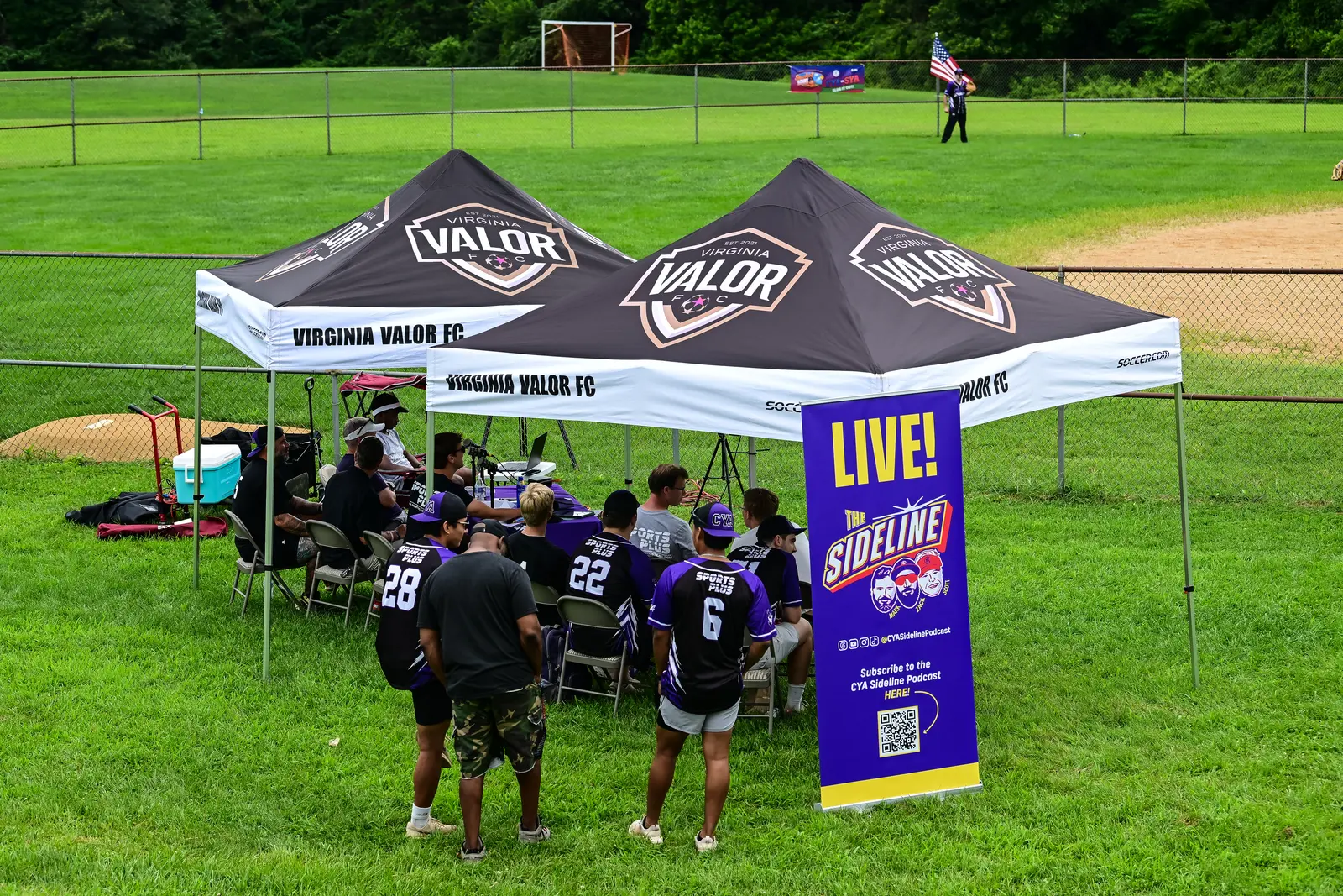 The Sideline Podcast live broadcast tent set up beside the Summer Slugfest field.